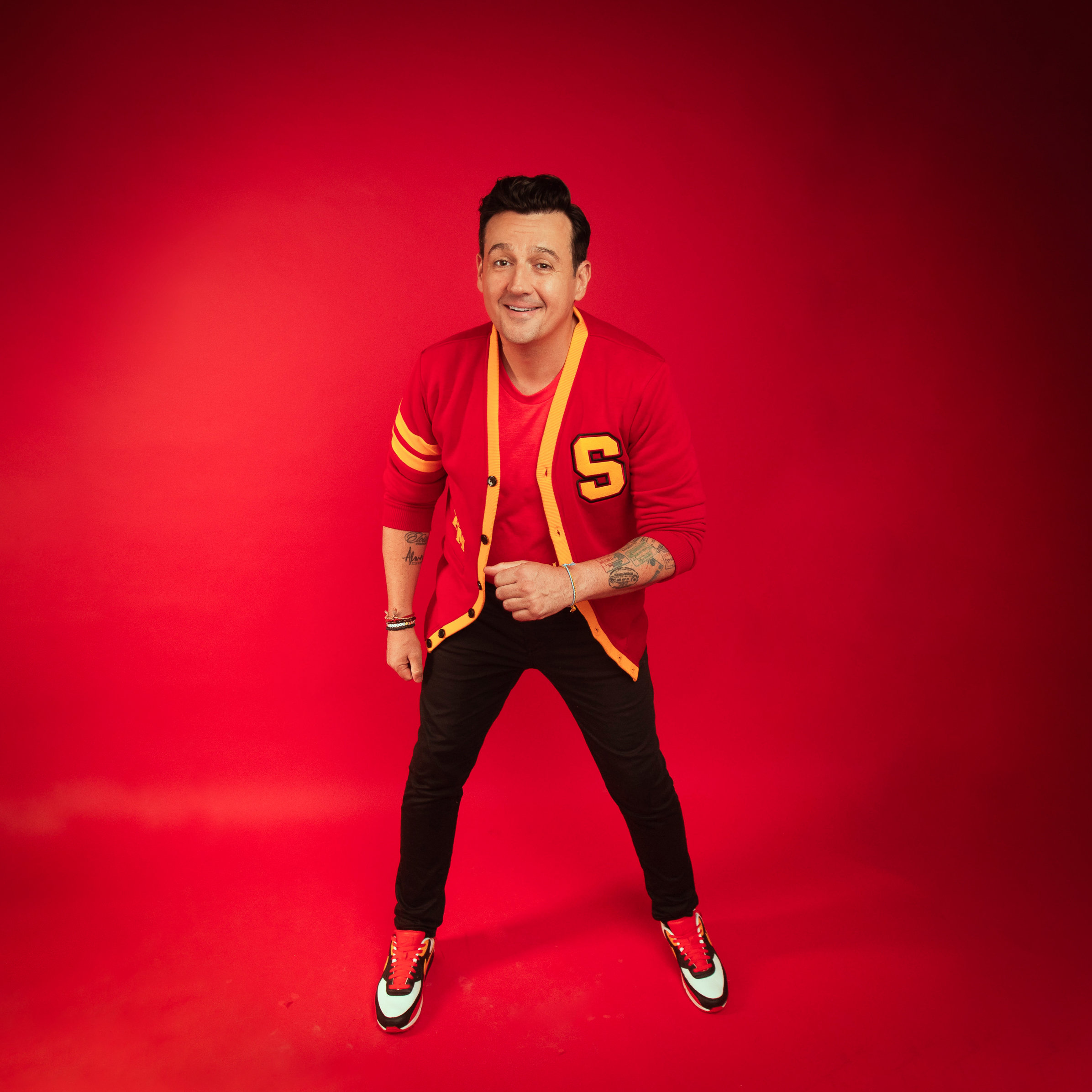 Sam Moran in his red varsity cardigan during the 2023 press shoot